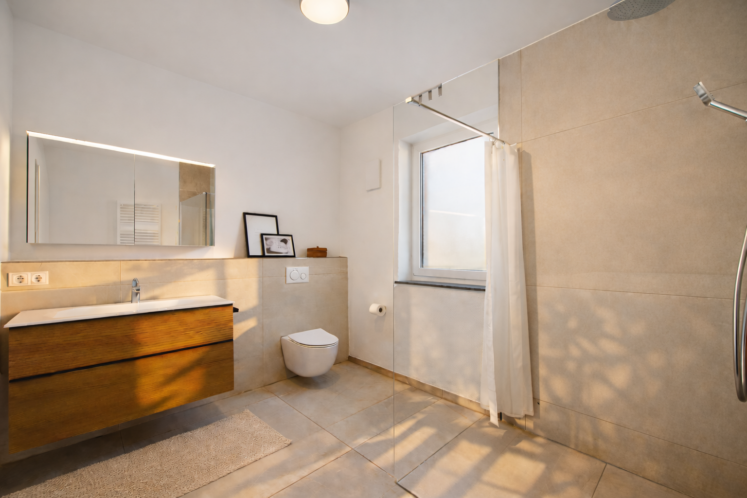 Modern bathroom with large sink and walk-in shower at TLA Ramstein 30/2